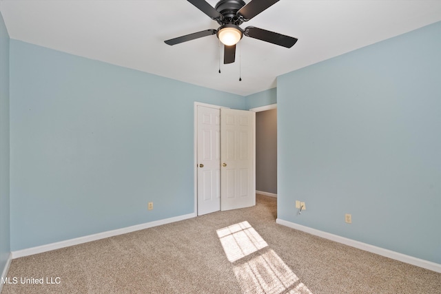 unfurnished bedroom with ceiling fan and light carpet