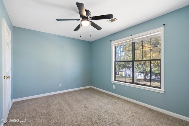 empty room with carpet flooring and ceiling fan