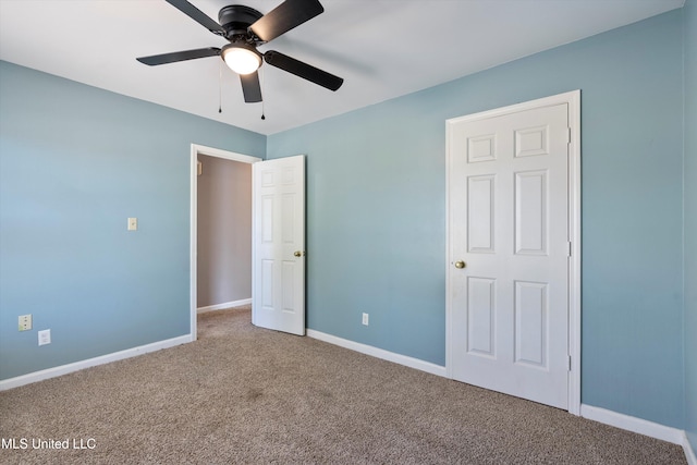 unfurnished bedroom featuring carpet flooring and ceiling fan