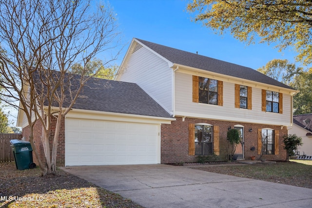 colonial inspired home featuring a garage