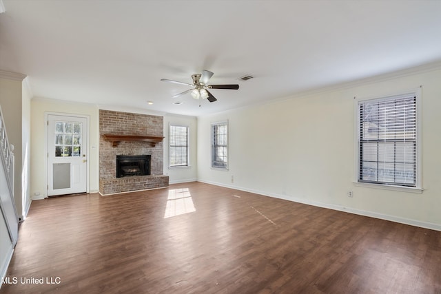 unfurnished living room featuring dark hardwood / wood-style flooring, a wealth of natural light, and a fireplace