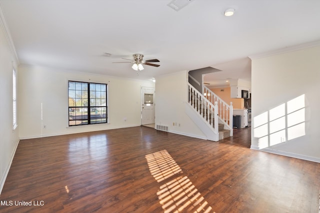 unfurnished living room with crown molding, ceiling fan, and dark wood-type flooring