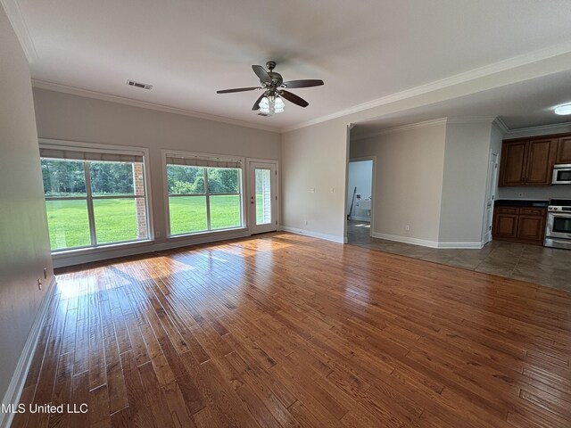 8 Jennie Ln, Picayune, MS 39466 - unfurnished living room featuring hardwood / wood-style flooring, a ceiling fan, baseboards, and crown molding