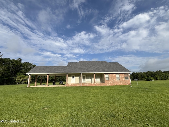 8 Jennie Ln, Picayune, MS 39466 - view of front of property featuring a front yard, brick siding, and an attached carport
