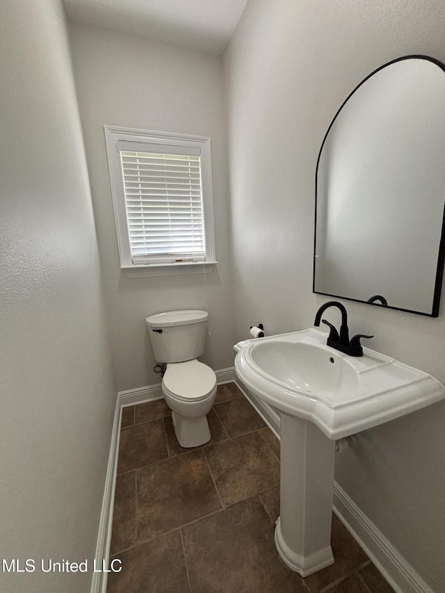 8 Jennie Ln, Picayune, MS 39466 - bathroom with toilet, baseboards, and tile patterned flooring