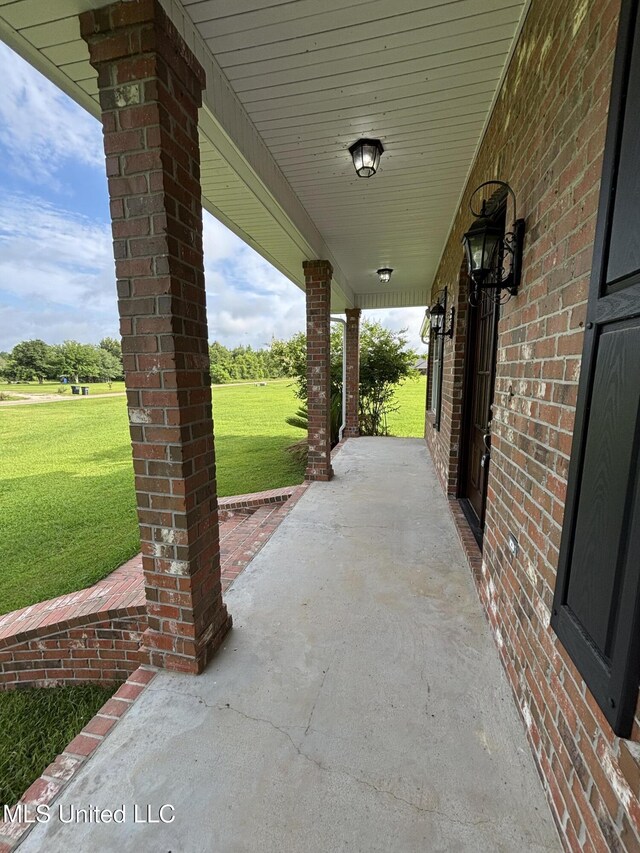 8 Jennie Ln, Picayune, MS 39466 - covered porch with a yard