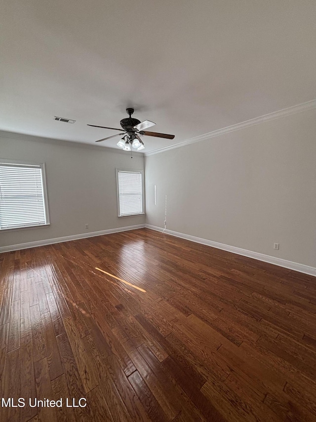 8 Jennie Ln, Picayune, MS 39466 - unfurnished room with dark wood finished floors, baseboards, ornamental molding, and a ceiling fan