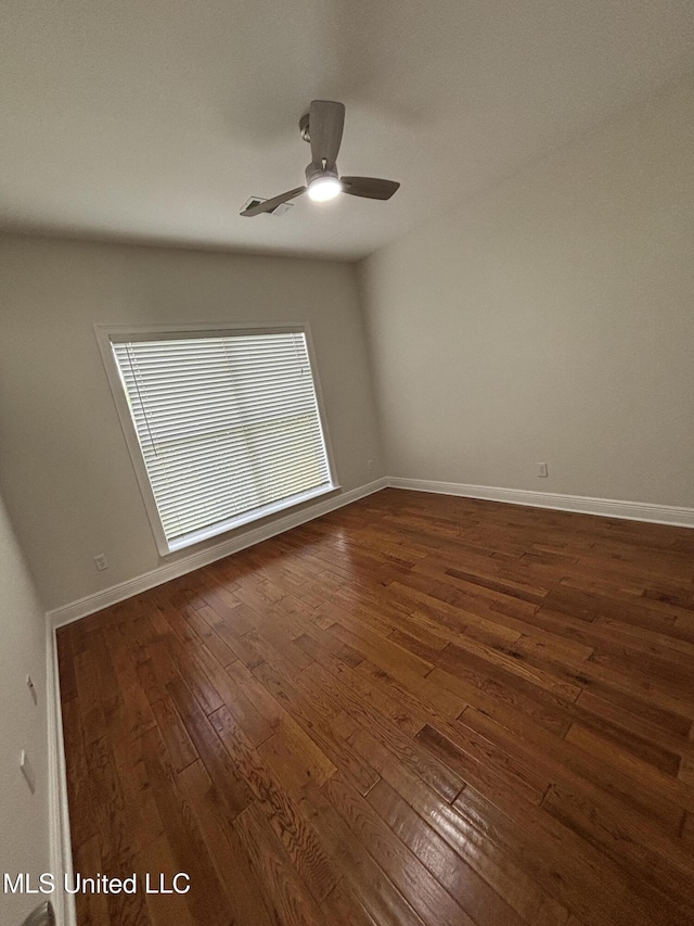 8 Jennie Ln, Picayune, MS 39466 - spare room featuring dark wood-style floors, baseboards, and a ceiling fan