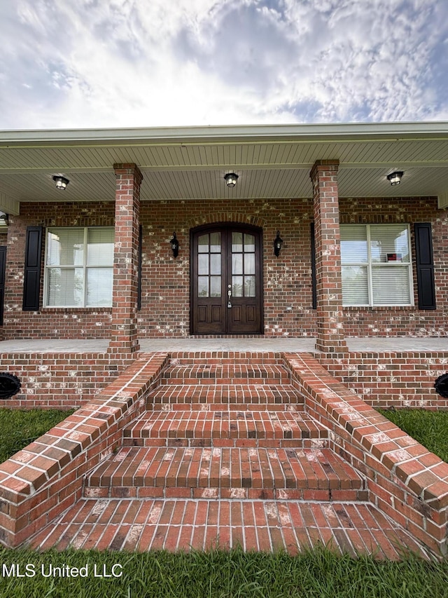 8 Jennie Ln, Picayune, MS 39466 - property entrance featuring covered porch and brick siding