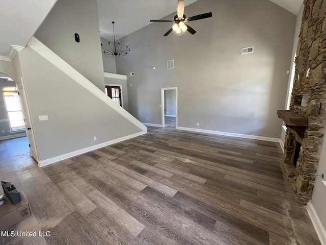 145 Poplar Ln, Holly Springs, MS 38635 - unfurnished living room featuring ceiling fan, arched walkways, high vaulted ceiling, baseboards, and wood finished floors