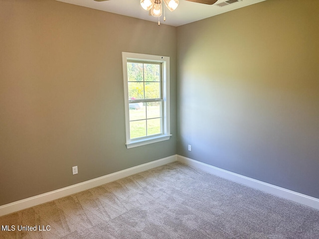 empty room featuring carpet floors and ceiling fan