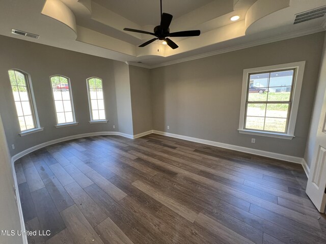 145 Poplar Ln, Holly Springs, MS 38635 - empty room with a tray ceiling, crown molding, dark wood-type flooring, baseboards, and a ceiling fan