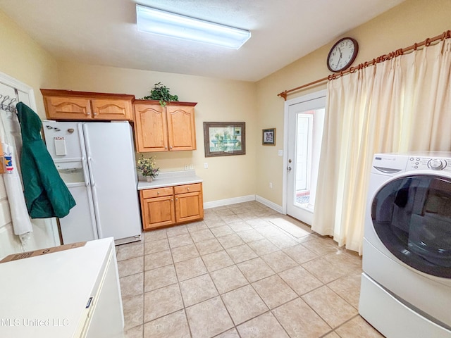 8855 Pine Springs Rd, Meridian, MS 39305 - laundry room with washer / dryer and light tile patterned floors