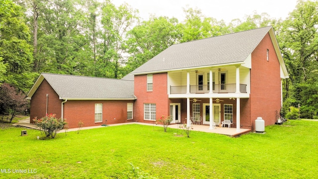 8855 Pine Springs Rd, Meridian, MS 39305 - back of property with ceiling fan, a balcony, brick siding, and a patio area