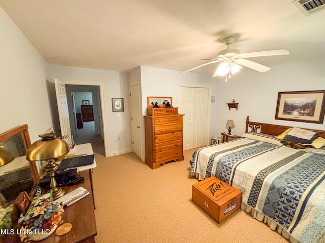 8855 Pine Springs Rd, Meridian, MS 39305 - bedroom featuring light carpet, a closet, and a ceiling fan