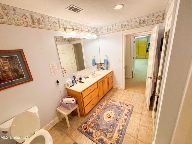 8855 Pine Springs Rd, Meridian, MS 39305 - bathroom with vanity, toilet, baseboards, tile patterned flooring, and recessed lighting