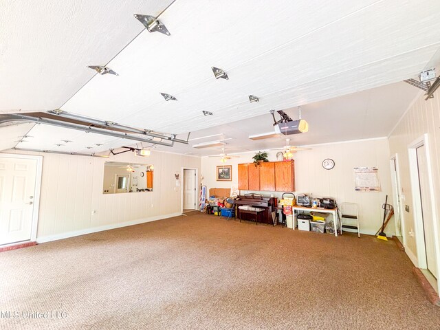 8855 Pine Springs Rd, Meridian, MS 39305 - garage featuring a garage door opener and baseboards