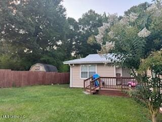 1124 Old Mobile Hwy, Lucedale, MS 39452 - back of house with a fenced backyard and a deck