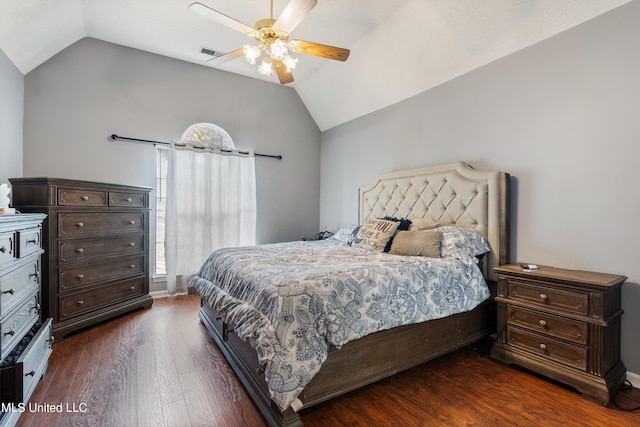 bedroom featuring dark wood-type flooring, ceiling fan, and vaulted ceiling