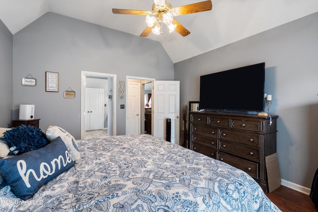 bedroom with ceiling fan, vaulted ceiling, and hardwood / wood-style floors