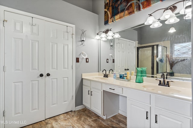 bathroom featuring vanity and an enclosed shower