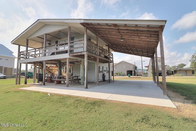 exterior space with a yard, a patio area, and a balcony