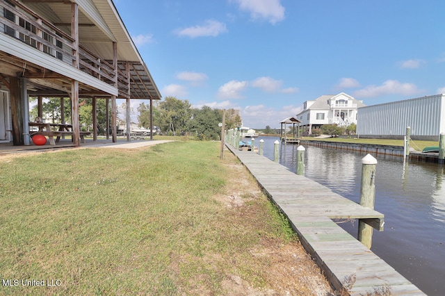 dock area featuring a water view and a yard