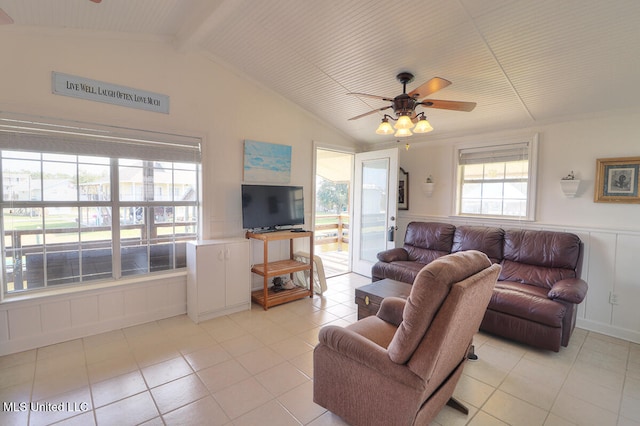 living room featuring light tile patterned flooring, vaulted ceiling, and ceiling fan