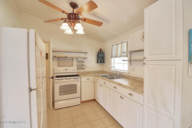 kitchen featuring white cabinetry, vaulted ceiling, ornamental molding, sink, and white appliances