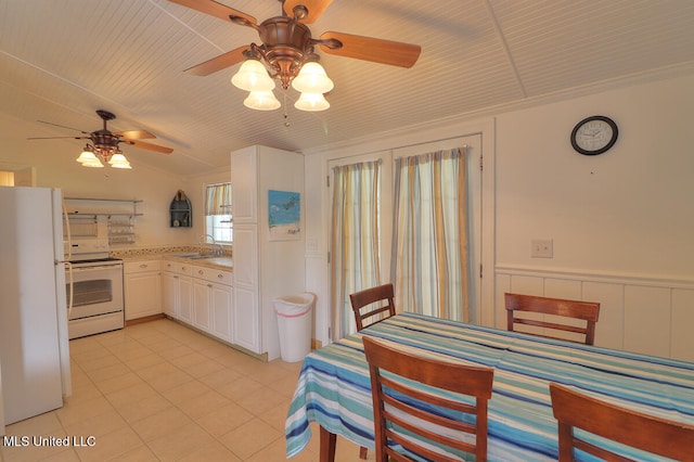 kitchen with white appliances, ceiling fan, white cabinetry, and sink