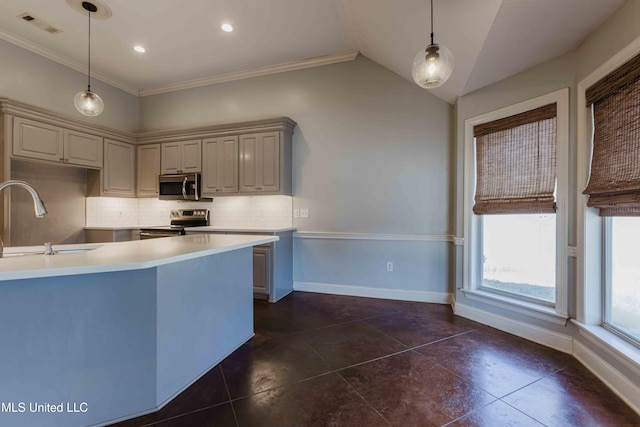 kitchen with pendant lighting, sink, gray cabinets, appliances with stainless steel finishes, and tasteful backsplash