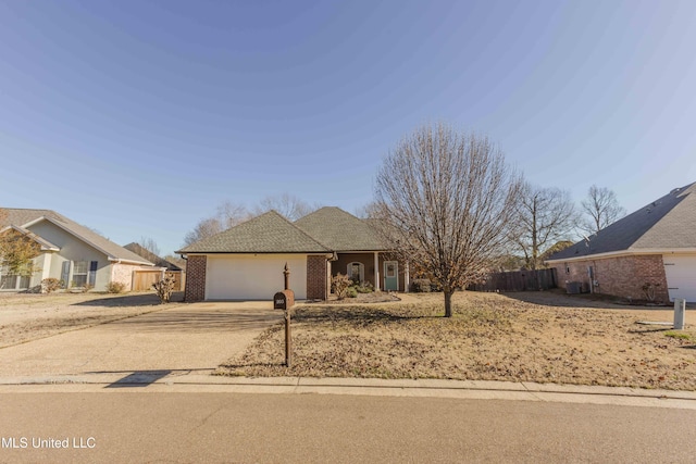 single story home featuring a garage