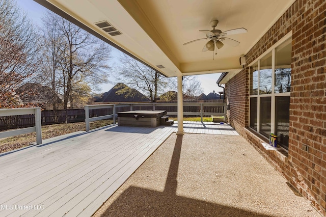 view of patio / terrace featuring a hot tub and ceiling fan