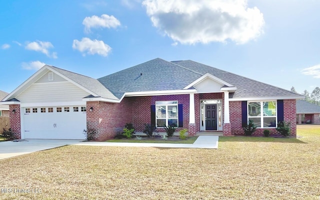view of front of house featuring a shingled roof, an attached garage, driveway, brick siding, and a front yard