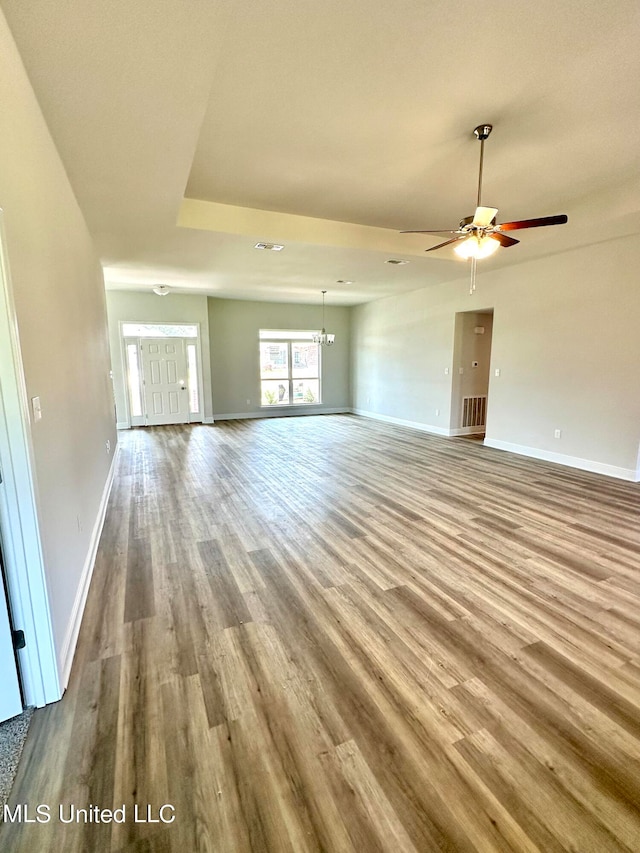 unfurnished living room with ceiling fan and light hardwood / wood-style floors