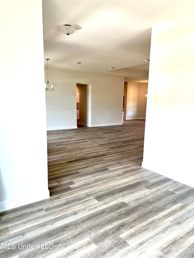 empty room with wood-type flooring