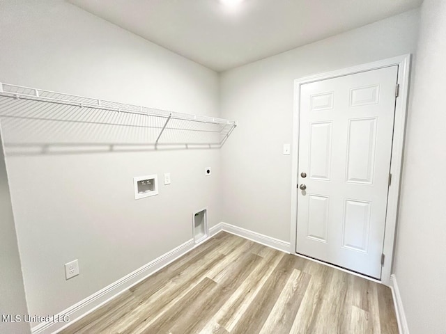 washroom with laundry area, hookup for a washing machine, baseboards, electric dryer hookup, and light wood-style flooring