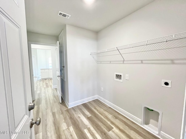 washroom featuring light wood finished floors, laundry area, hookup for an electric dryer, hookup for a washing machine, and baseboards
