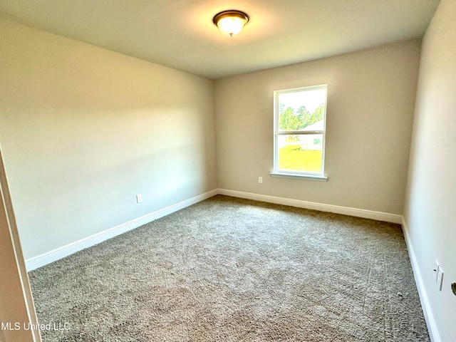 unfurnished room with carpet floors