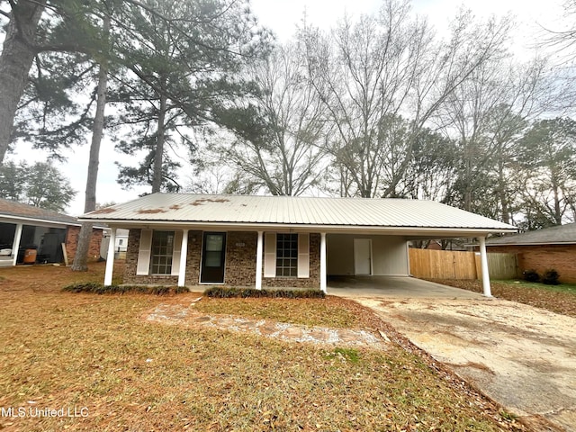 239 Traceland Dr, Madison, MS 39110 - ranch-style home with a carport, metal roof, concrete driveway, and covered porch