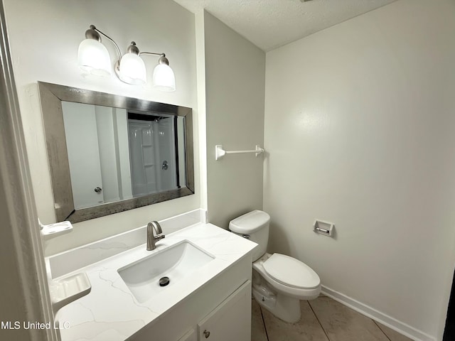 239 Traceland Dr, Madison, MS 39110 - full bathroom with vanity, toilet, a textured ceiling, tile patterned flooring, and baseboards