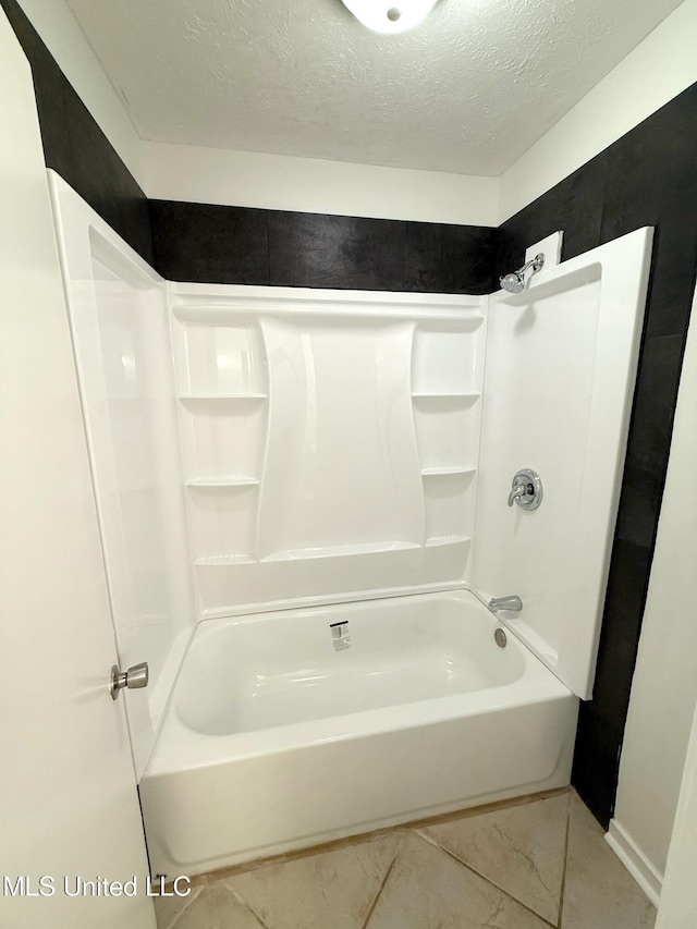 239 Traceland Dr, Madison, MS 39110 - bathroom featuring a textured ceiling and shower / bathtub combination