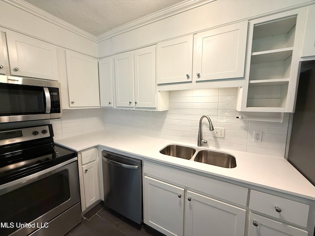 239 Traceland Dr, Madison, MS 39110 - kitchen featuring stainless steel appliances, a sink, decorative backsplash, light countertops, and ornamental molding
