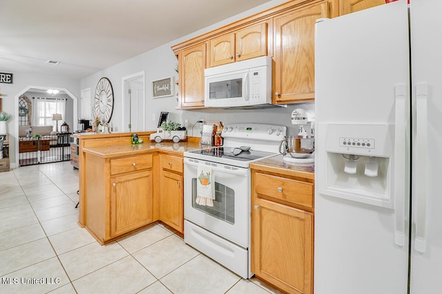 kitchen featuring kitchen peninsula, light brown cabinetry, light tile patterned floors, and white appliances