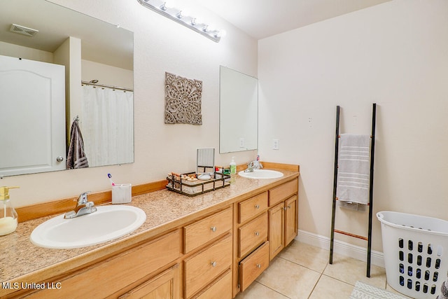 bathroom with vanity and tile patterned floors