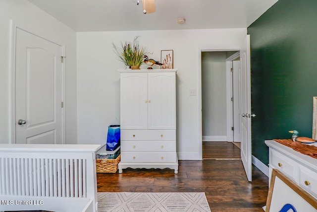 bedroom with dark wood-type flooring and ceiling fan