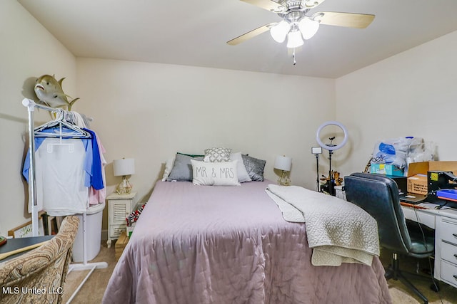 bedroom featuring light carpet and ceiling fan