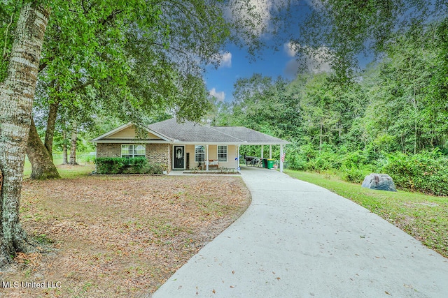 ranch-style house with a porch and a carport