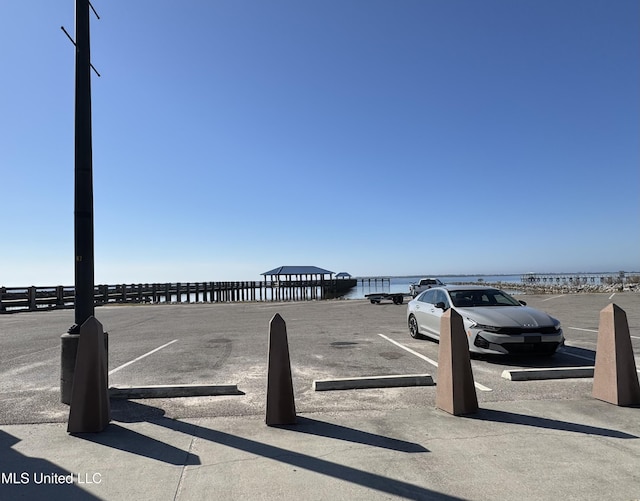 view of parking with a water view