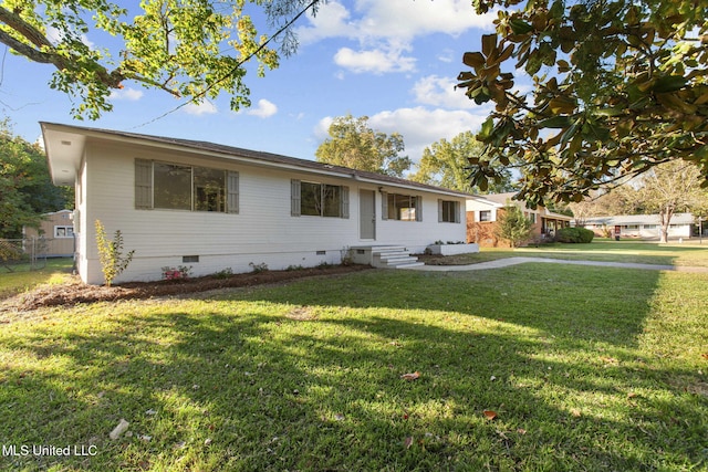 ranch-style home with a front yard